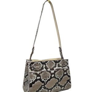 May include: A trio of ceramic mugs with a speckled, matte finish in cream, light grey, and dark grey. Each mug features a simple, minimalist design, ideal for tea or coffee.