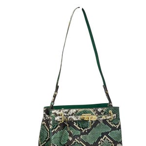 May include: A green and black snakeskin-patterned handbag with a gold-tone clasp and hardware. The bag has a top handle and a long, adjustable shoulder strap. The interior is lined with green fabric. The bag is a stylish accessory.
