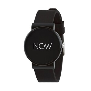 May include: A black wristwatch with a round face. The watch face displays the word "NOW" in white. The watch has a black band and a silver clasp. The watch is a minimalist design.