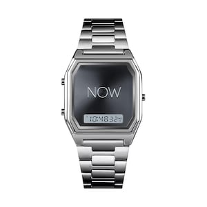 May include: A silver-toned wristwatch with a rectangular face and a linked metal band. The watch face is dark gray with the word "NOW" in the center and a digital time display showing "10:48:32".