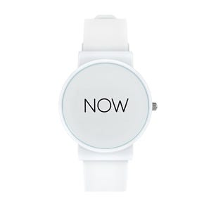 May include: A white wristwatch with a round face and a white band. The watch face displays the word "NOW" in black, centered on a white background. The watch has a simple, minimalist design.