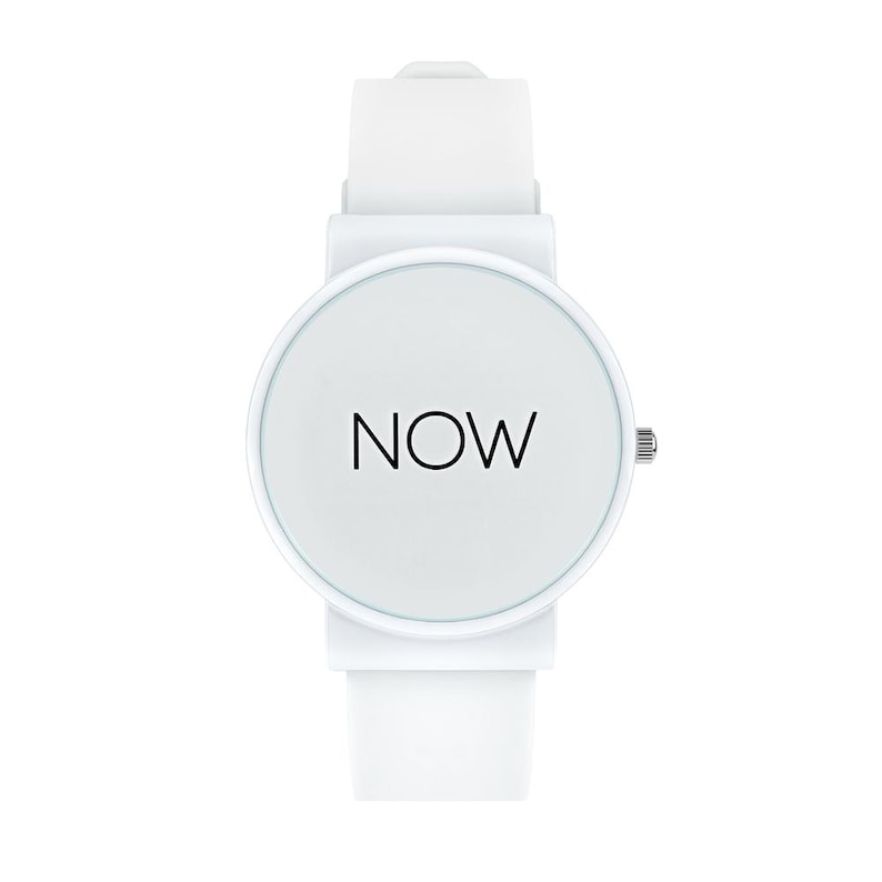 May include: A white wristwatch with a round face and a white band. The watch face displays the word "NOW" in black, centered on a white background. The watch has a simple, minimalist design.