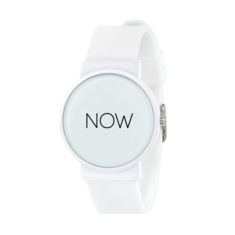 May include: A white wristwatch with a round face and a white silicone band. The watch face displays the word "NOW" in black, centered on a white background. The watch has a silver clasp.