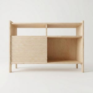 May include: A light-coloured wooden cabinet with a sliding door featuring horizontal slats. The cabinet has open shelving above and a lower shelf, offering storage space. The design is minimalist and modern, suitable for various home decor styles.