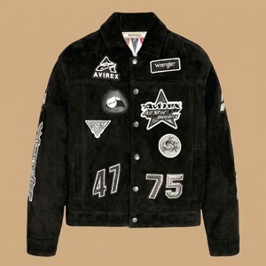 May include: Black suede jacket with various patches, including "Avirex" and "Wrangler". The jacket has the numbers "47" and "75" and is fastened with buttons. The sleeves display white lettering. A classic, stylish piece.