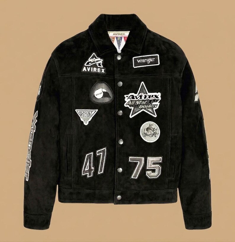 May include: Black suede jacket with various patches, including "Avirex" and "Wrangler". The jacket has the numbers "47" and "75" and is fastened with buttons. The sleeves display white lettering. A classic, stylish piece.