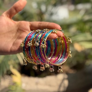 May include: A set of three ceramic mugs with a speckled, matte finish. The mugs are in shades of cream, light gray, and dark gray. Each mug has a simple, minimalist design and a rounded handle. Perfect for coffee or tea.