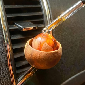 May include: A set of three ceramic mugs with a speckled, matte finish. Each mug features a different color: light blue, cream, and gray. The mugs have a simple, modern design with a rounded shape and a handle.