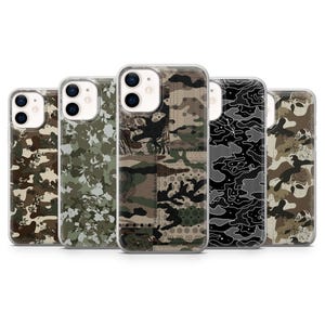 May include: Five clear smartphone cases arranged in a row, each featuring a distinct camouflage pattern. The designs include various shades of green, brown, black, and white, with some patterns incorporating floral or geometric motifs across the back.