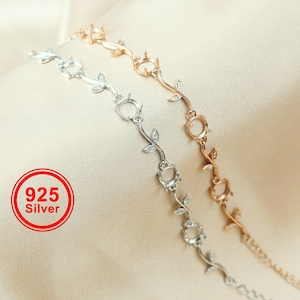 Puede incluir: Dos pulseras de plata y oro rosa con un diseño floral. Cada pulsera presenta una delicada vid con hojas y engastes para piedras preciosas. La imagen incluye un círculo rojo con el texto "925 Silver".