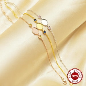 May include: Three silver chain bracelets with oval-shaped charms and small colorful gemstones. The charms are blank and ready for customization. The bracelets are labeled "Real 925 Sterling Silver".