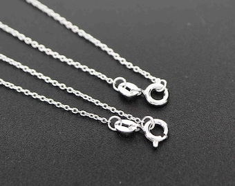 May include: Three silver chains of different lengths with lobster claw clasps.