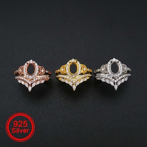 May include: Three silver rings with a crown design and clear stones. The rings are in rose gold, yellow gold, and silver.
