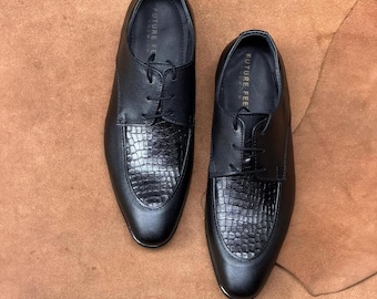 May include: A pair of black lace-up dress shoes featuring a smooth leather finish on the sides and a textured, embossed crocodile-pattern leather panel on the vamp. The interior insoles are clearly marked with the text Future Fee Premium.