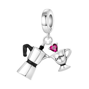 May include: Silver charm with a coffee theme. The charm features a coffee maker, a cup with the word "Coffee", and a heart-shaped gem. The charm is suspended from a silver loop.