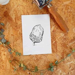 A6 original linocut print. Acorn.