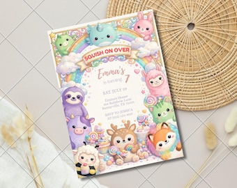 May include: A rectangular birthday invitation card featuring a colorful rainbow, clouds, and various cartoon animals including a narwhal, bunny, sloth, cow, deer, and fox. The text reads SQUISH ON OVER, Emma's is turning 7, SAT. JULY 19, and RSVP details.