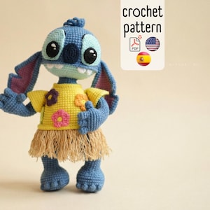 May include: A blue crochet Stitch doll wearing a yellow shirt with flower accents and a tan grass skirt. The doll has large black eyes and a toothy grin. The image includes the text "crochet pattern".