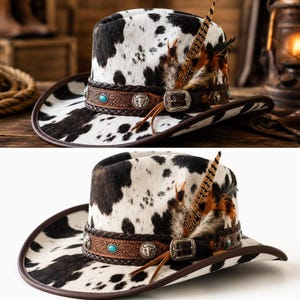 May include: A cowhide print cowboy hat featuring a brown leather band with braided edges, silver-toned metal conchos, a turquoise stone inlay, and a silver buckle. The hat is accented with brown and tan feathers tucked into the side of the band.