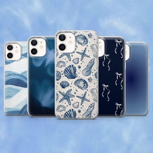 May include: Five smartphone cases arranged in a row. The first features blue and white waves, the second is a solid dark blue, the third displays a pattern of blue seashells and starfish on a cream background, the fourth has white ribbons on navy blue, and the fifth is a translucent blue.