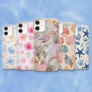 May include: Five smartphone cases arranged in a row, each featuring a unique coastal design. The patterns include light blue flowers, pink hibiscus blossoms, a detailed collage of seashells and pearls, colorful seashells, and blue starfish on a cream background.