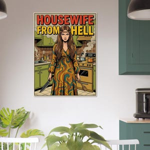 May include: A pop art style print featuring a woman in a kitchen holding a knife and a wooden spoon. The text "HOUSEWIFE FROM HELL" is displayed in bold letters at the top of the image. The woman is wearing a long, patterned dress.