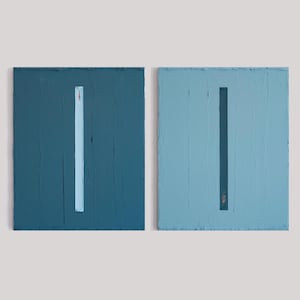 May include: Two rectangular canvas paintings featuring thick, textured paint application. The left painting is dark teal with a vertical light blue stripe. The right painting is light blue with a vertical dark teal stripe, both with small red accents.