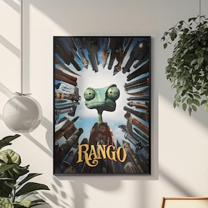 May include: A framed movie poster for the animated film "Rango." The poster features a cartoon chameleon surrounded by guns, with the title "Rango" in gold lettering. The background is a blue sky.