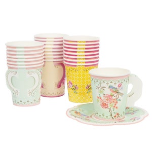 May include: Set of pastel-colored paper teacups and saucers with floral and bird designs. The cups have handles and the saucers have scalloped edges.