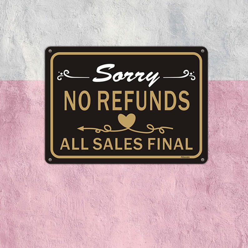 May include: Black and gold sign with the text "Sorry - No Refunds - All Sales Final" with a heart symbol.