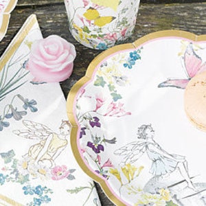 May include: A set of white paper plates with a gold rim and a floral design featuring fairies and butterflies. The plates are perfect for a whimsical party or tea party.