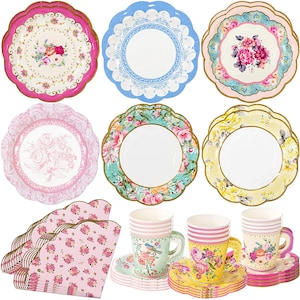 May include: A set of vintage-inspired paper party supplies, including plates, napkins, and cups. The plates feature floral designs in pink, blue, and yellow. The napkins are pink with a floral pattern. The cups are white with floral designs and come with matching saucers.