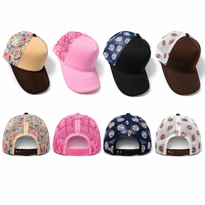 May include: A collection of eight trucker hats featuring four distinct designs: a floral print with a tan front, a solid pink, a baseball pattern with a black front, and a football print with a brown front, all with mesh backs and snapback closures.