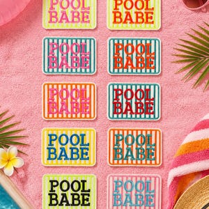 May include: Ten rectangular embroidered patches arranged in two columns. Each patch features vertical stripes and the text "POOL BABE" in various color combinations, including pink, orange, teal, blue, yellow, and black on white backgrounds.