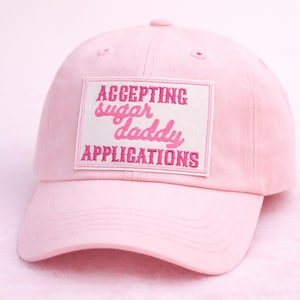 May include: A set of three ceramic vases in varying heights and shapes. The vases are glazed in a matte white finish, offering a minimalist aesthetic. The tallest vase is approximately 10 inches high.