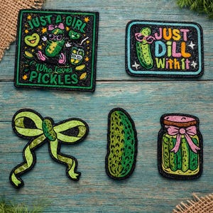 May include: A set of three ceramic mugs with a speckled, matte finish. The mugs are in shades of cream, light gray, and dark gray. Each mug has a simple, minimalist design and a rounded handle.