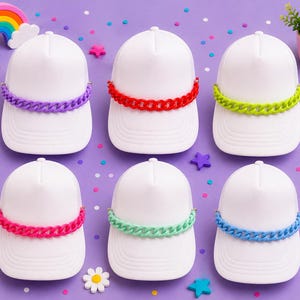May include: Six white baseball caps arranged in two rows. Each cap features a thick, plastic chain link band across the front in a different solid color: purple, red, lime green, hot pink, mint green, and bright blue.