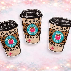 May include: Three embroidered patches shaped like coffee cups. The cups have black lids and tan leopard print sleeves. Each patch has a teal circle with the words "Teacher Coffee" and a red apple.