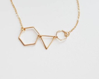 Golden geometric  pendant necklace. Minimalistic necklace. Hexagone triangle necklace