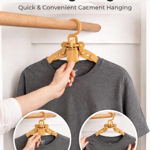 May include: A tan Easy Release Clothing Hanger is shown holding a grey t-shirt. The hanger is attached to a wooden rail. The text on the image says "Quick & Convenient Catment Hanging". Two smaller images show the hanger in use, labelled "Pull Down" and "Hang & Release".