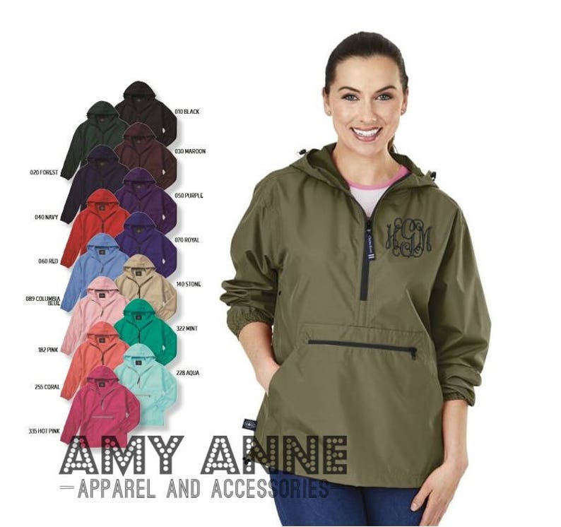May include: A green hooded jacket with a zip and a large pocket on the front. The jacket has a monogram on the pocket. The jacket is available in a range of colours.
