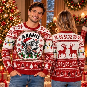 May include: A red and white knit sweater featuring a central graphic of a goat wearing a Santa hat with the text AAAH!! above it, surrounded by candy canes and holly. The sleeves and hem have patterns of Christmas trees and string lights.