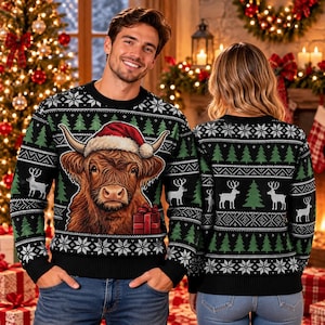 May include: A black long-sleeve sweater featuring a graphic of a Highland cow wearing a red Santa hat next to a red gift box. The sweater has a repeating pattern of white snowflakes, green pine trees, and white reindeer silhouettes.