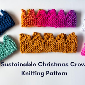 May include: A collection of colorful, knitted crowns in various shades of blue, green, orange, pink, and white. The crowns are arranged on a white surface. Text at the bottom reads "Sustainable Christmas Crown Knitting Pattern."