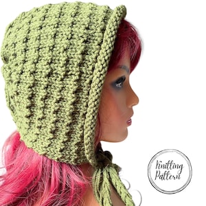 May include: A light green knitted bonnet with a textured pattern and a braided edge. The bonnet has a tassel on each side and the text "Knitting Pattern" in a circular logo.