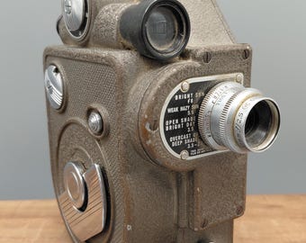Cámara de cine vintage Revere Eight de 8 mm, de mediados de siglo, de la compañía Revere, con lente Cine Raptar f/2.5.
