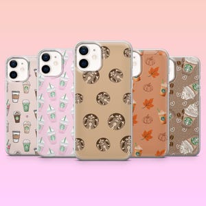 May include: Five clear phone cases with various designs. One case features coffee cups, another pink drinks, a third with brown logos, a fourth with pumpkins and leaves, and the last with coffee drinks and hearts.