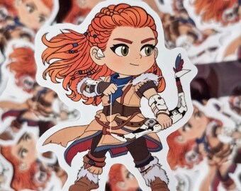 May include: A sticker featuring a cartoon illustration of a character with red hair, wearing a tan and brown outfit with a bow and arrow. The character has green eyes and is surrounded by other similar stickers.