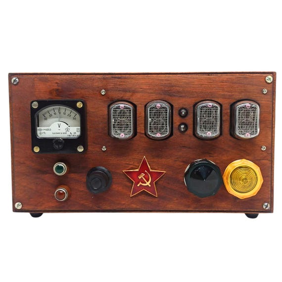 A handmade Nixie tube clock in a wooden steampunk case, inspired by Metro 2033's post-apocalyptic aesthetic — real IN-12 tubes glowing orange in a one-of-a-kind build.