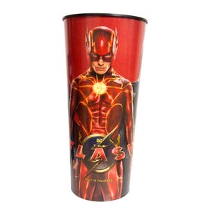 May include: A tall, cylindrical plastic cup featuring a vibrant red and orange graphic of The Flash. The character is centered with a lightning bolt emblem on the chest. Below the figure, the text reads DC THE FLASH ONLY IN THEATERS.